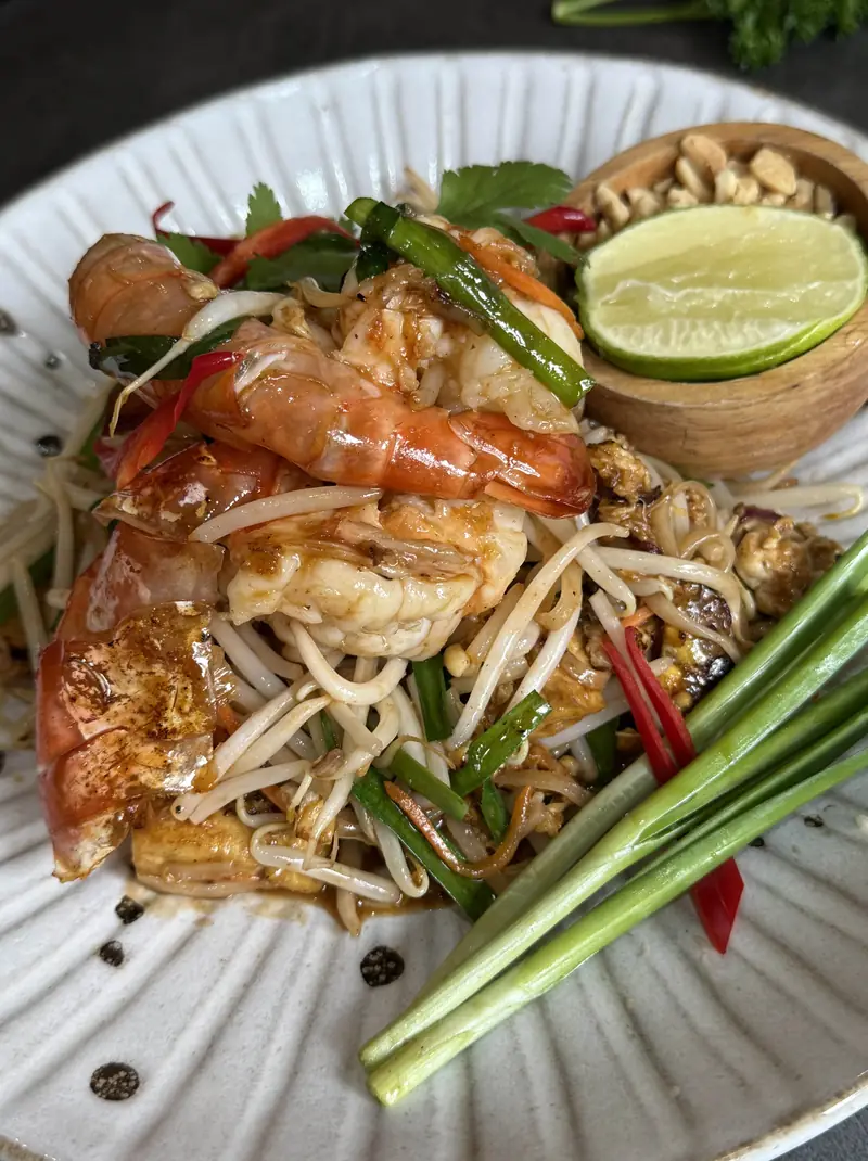 Prawn pad thai with lime, beansprouts, spring onion and crushed peanuts