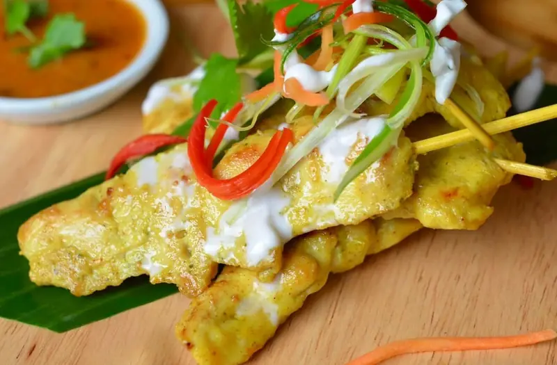 Chicken satay skewers with chilli and fresh herbs